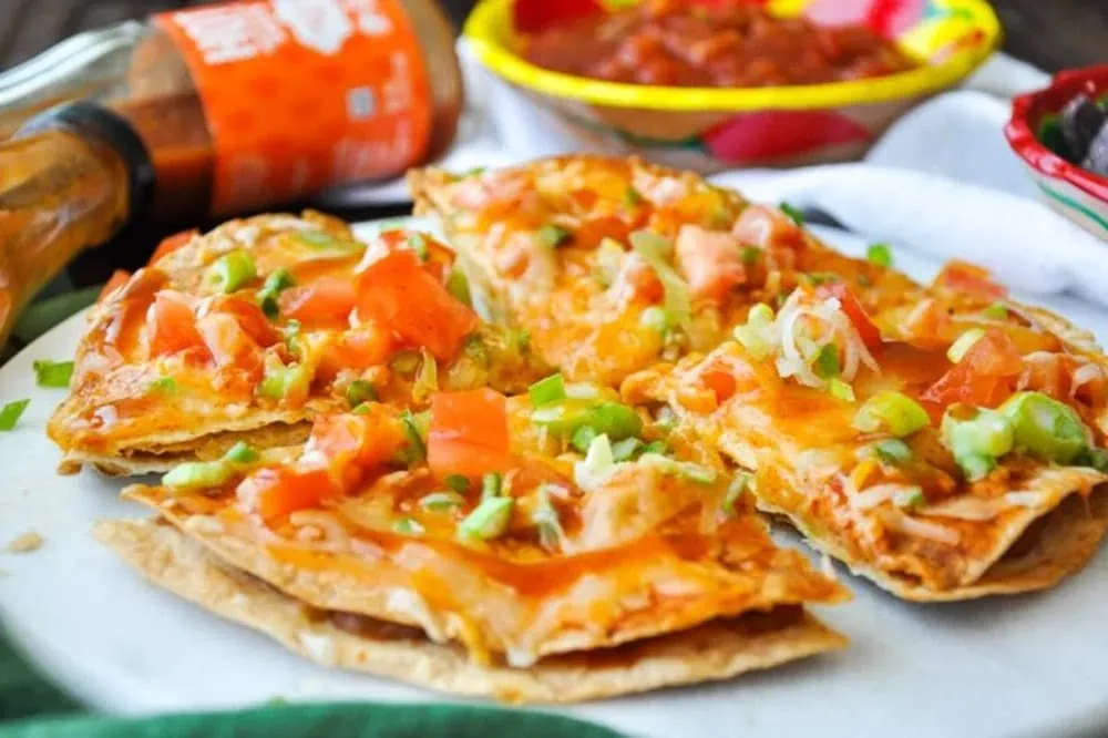 Mexican tortilla pizza in a white plate