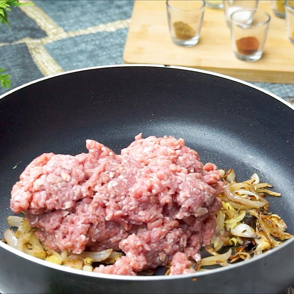 add Minced meat to the pan, creating a flavorful base for the Keema Pulao.
