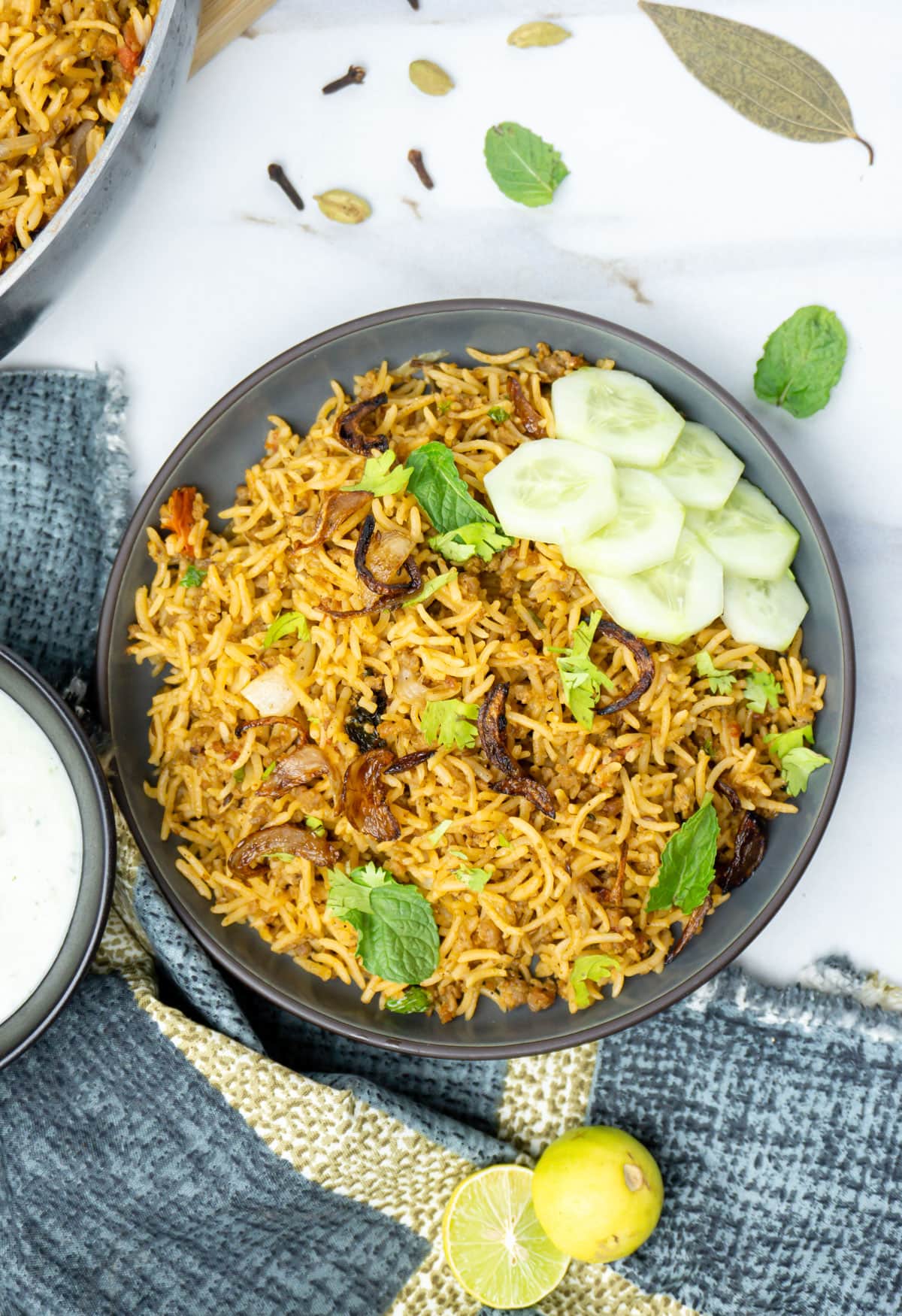 keema pulao with cucumber on the side
