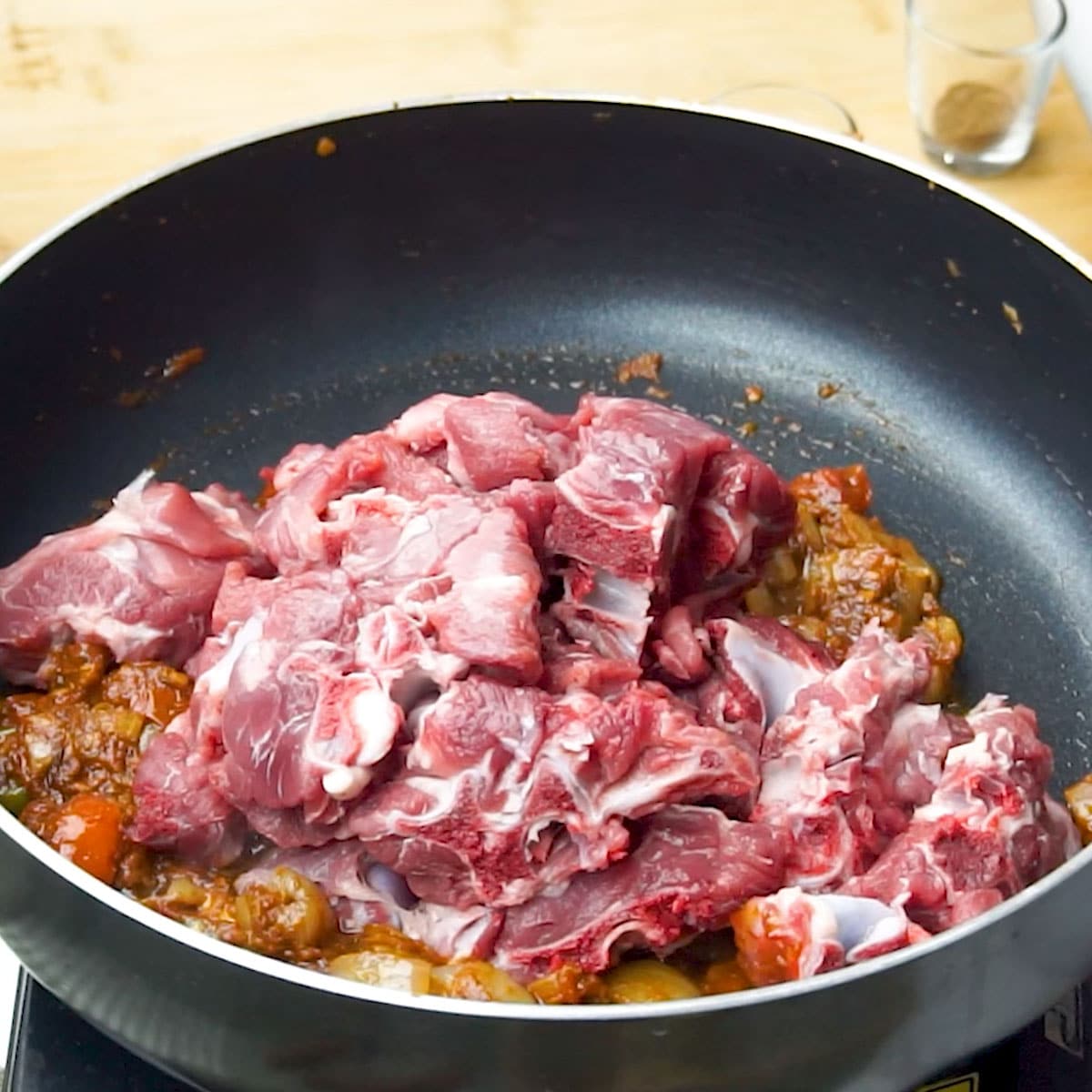 add mutton to the black non stick pan
