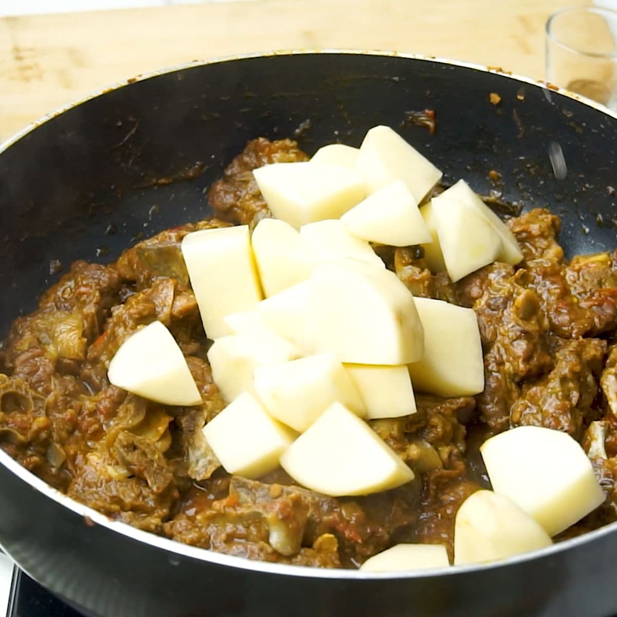 Cook potatoes until soft, absorbing the spices and adding texture.