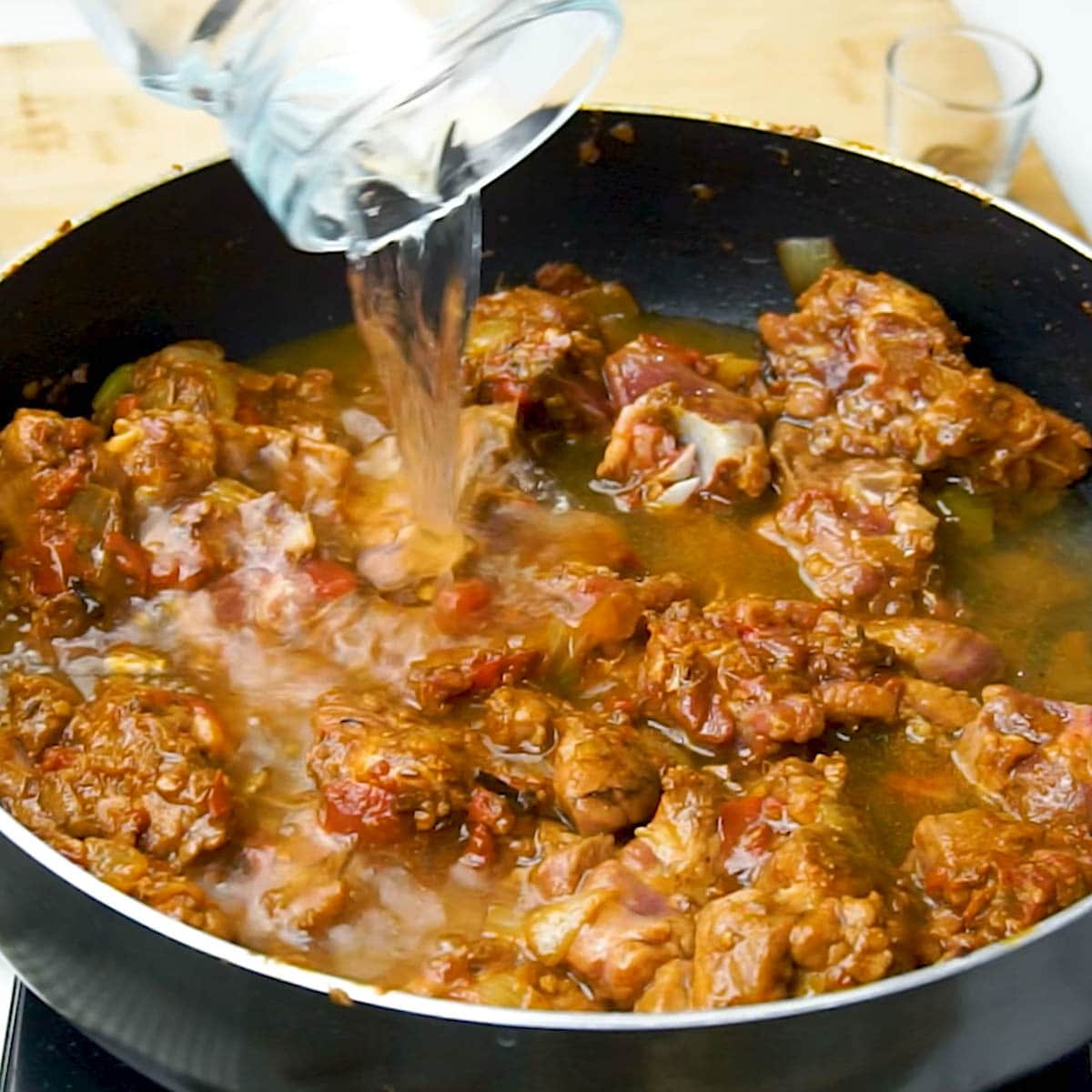 Add water, simmering to tenderize the meat and create a flavorful base.