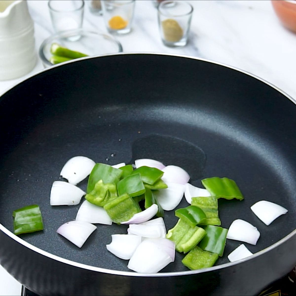 add Green Bell Pepper to the pan.