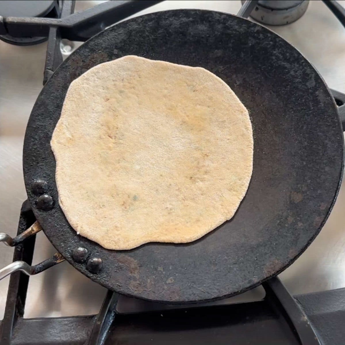 Add rolled paratha to Pan