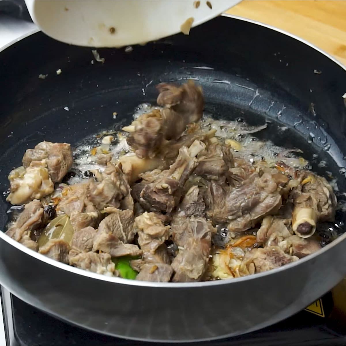 Add cooked mutton to the pot