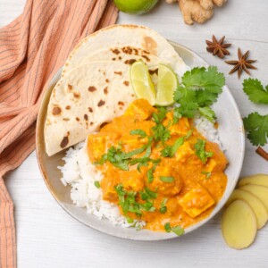 Vegan Tofu Tikka Masala with cilantro and roti