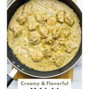 Malai chicken curry in white gravy in a pan