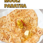 Mooli paratha in a plate with butter