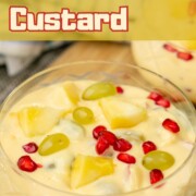 Fruit custard made with milk and brown and polson custard powder served in a glass bowl.