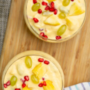 Indian Fruit custard with mango, grapes and pomegranates served in 2 bowls