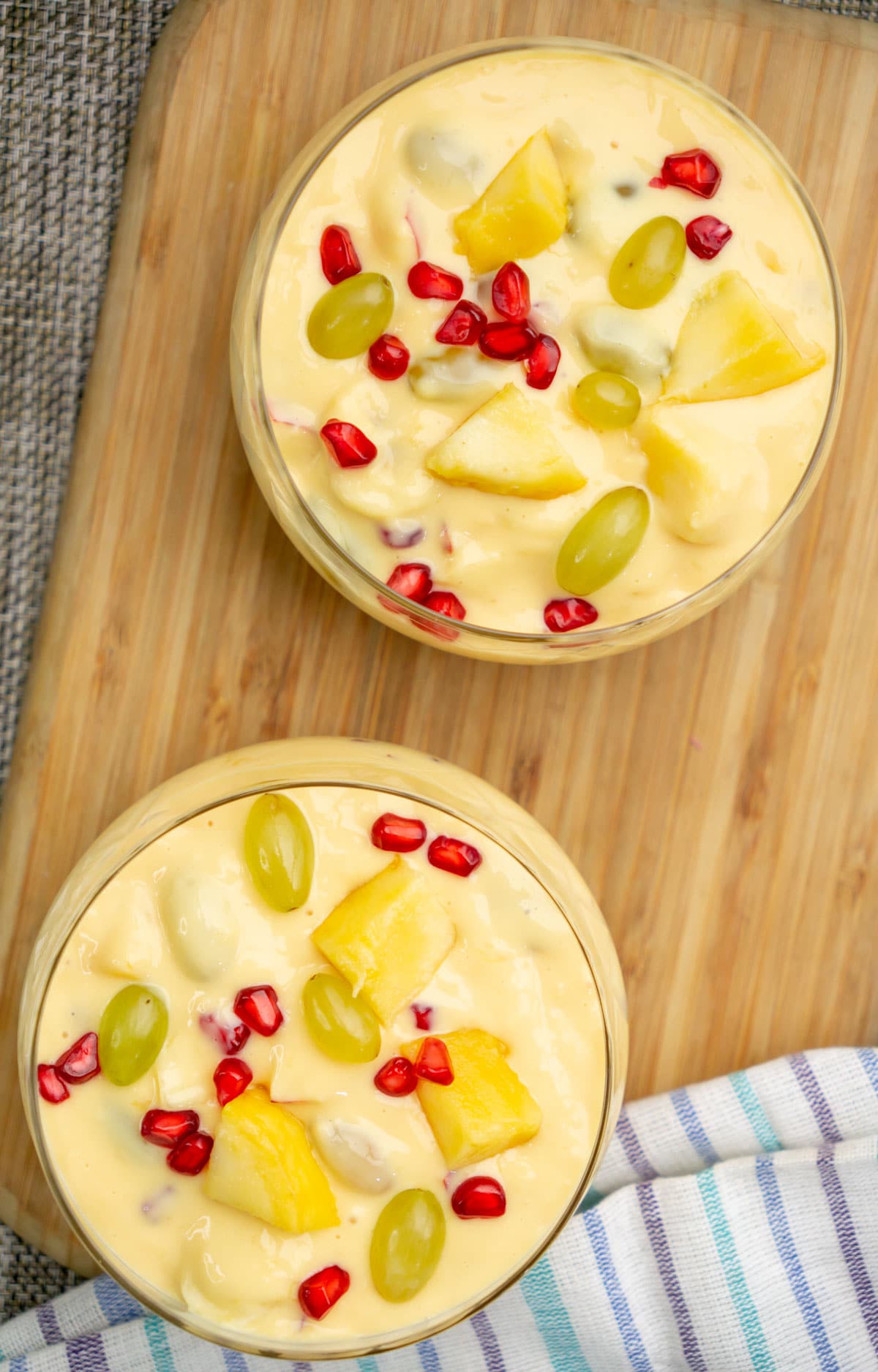 Indian Fruit custard with mango, grapes and pomegranates served in 2 bowls