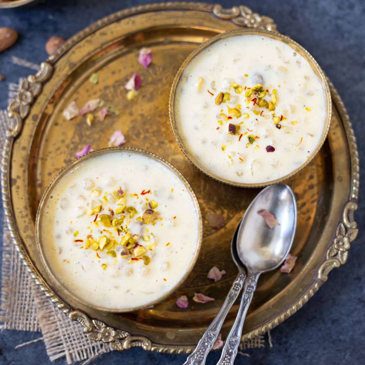 Sabudana kheer served in two bowls garnished with nuts
