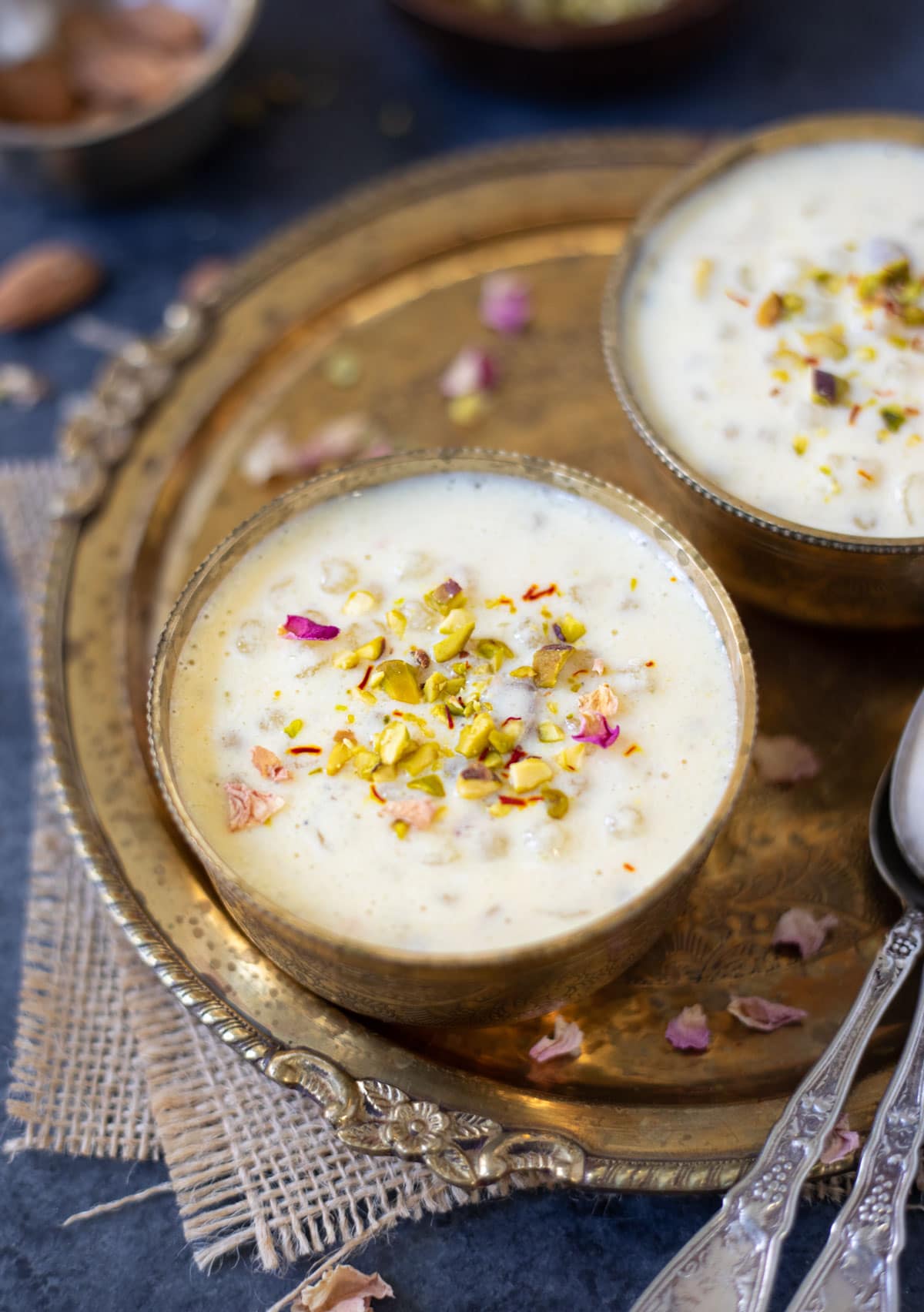 Sabudana kheer served in two bowls garnished with nuts