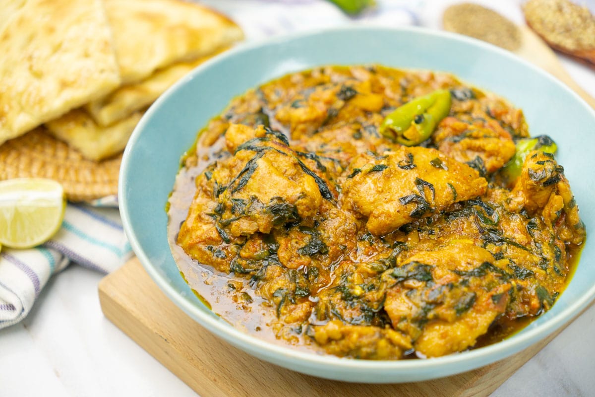 Methi Chicken with green chilies on the top