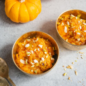 Indian Sweet Pumpkin Halwa served in a bowl garnished with almonds and pistachios.