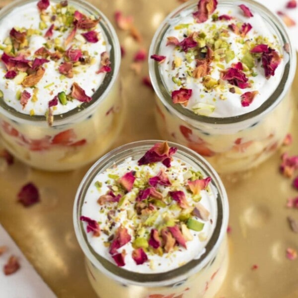 Custard Trifle Cups For Diwali decorated with dried rose petals and chopped pistachios.