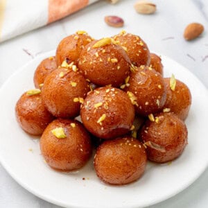 Gulab Jamun (Sweet Indian dessert balls) served in a plate