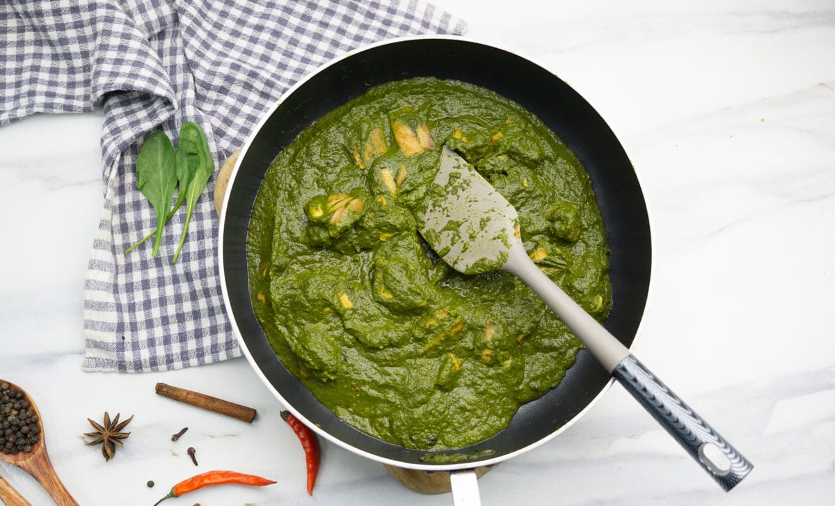 Luscious Chicken Saag cooked in a pan.