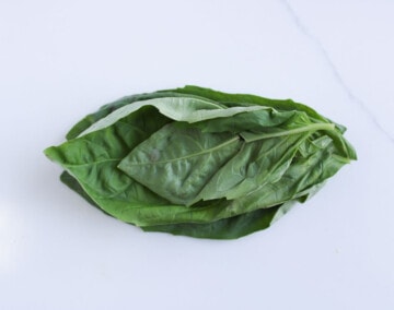 Stack basil leaves to chiffonade