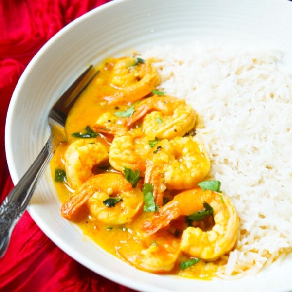 Shrimp curry made in the instant pot served in a bowl with rice.