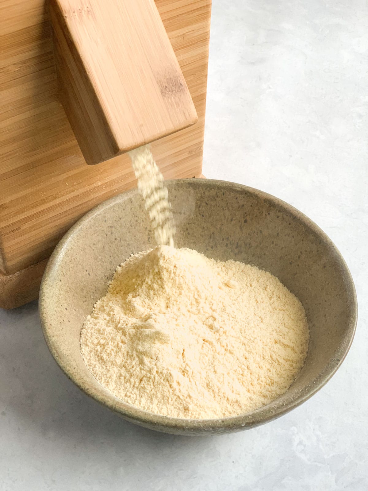 Chickpea flour coming of a stone mill