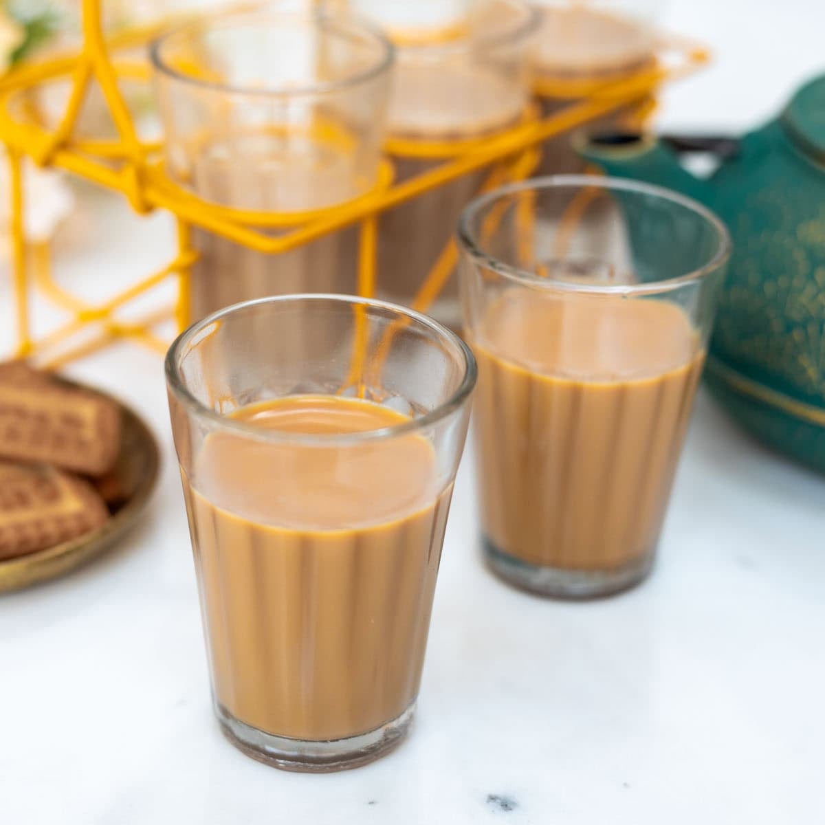 Masala chai served in two glasses.