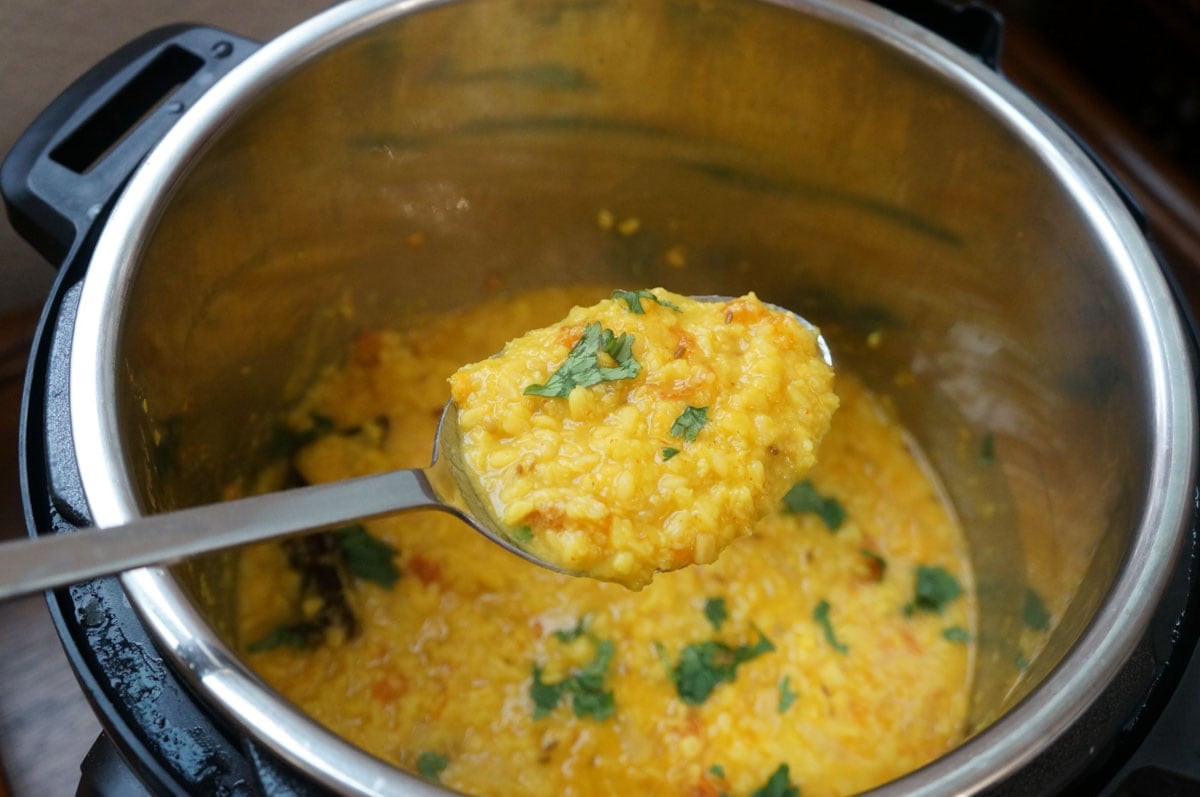 Moong dal in a serving spoon over the instant pot