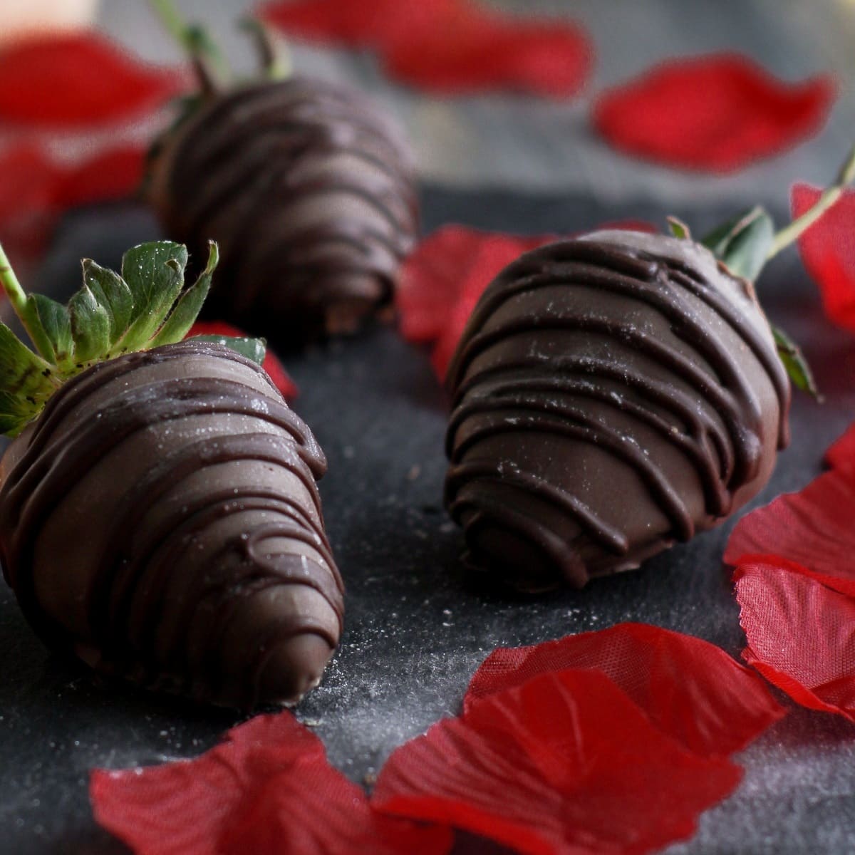 three chocolate covered strawberries