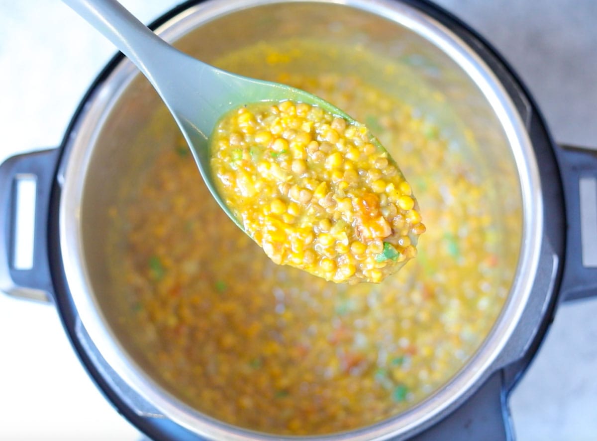 whole masoor dal in a ladle