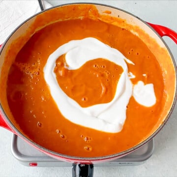 Pouring the coconut milk over the boiling Pumpkin Carrot Soup