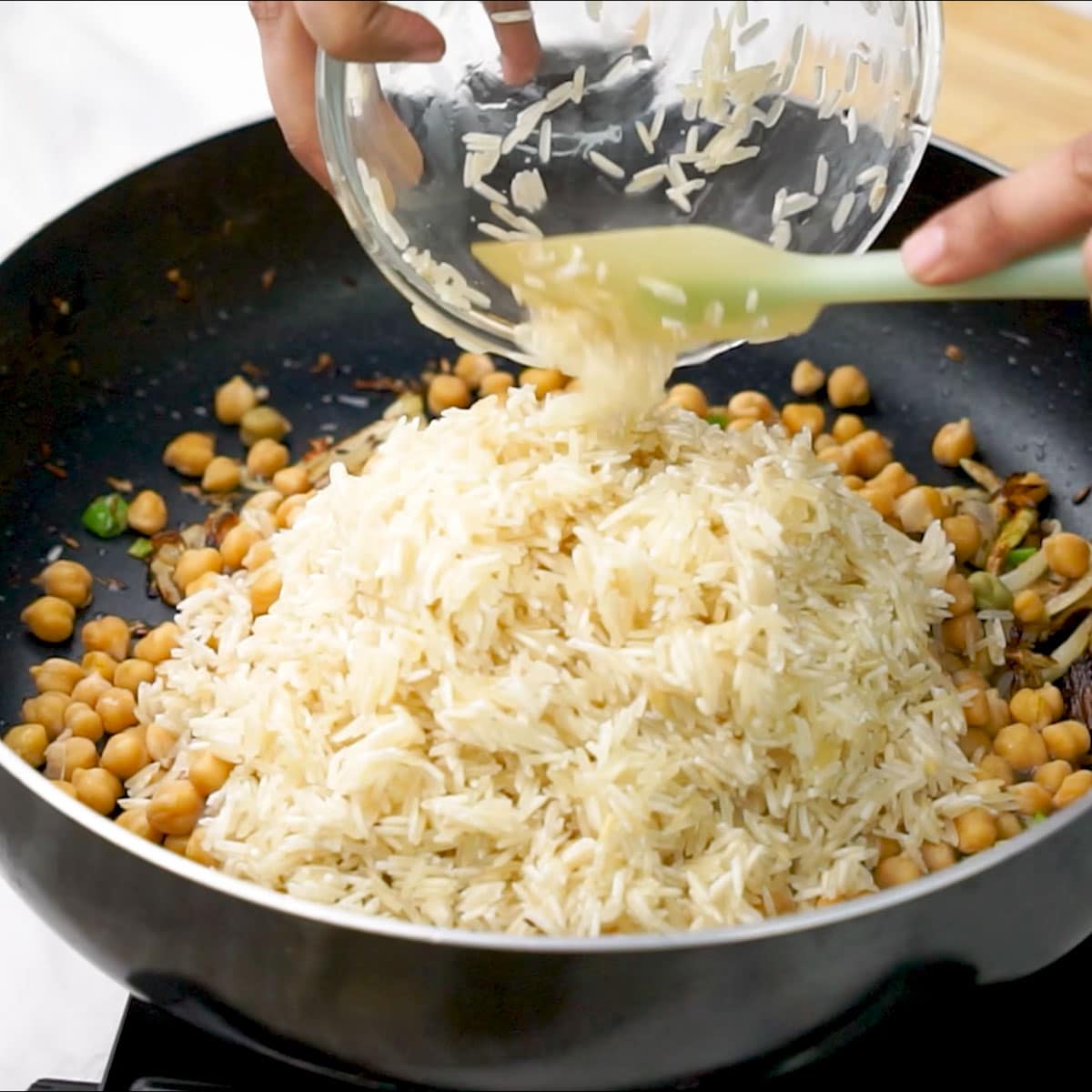 Adding Basmati Rice to the pan along with water