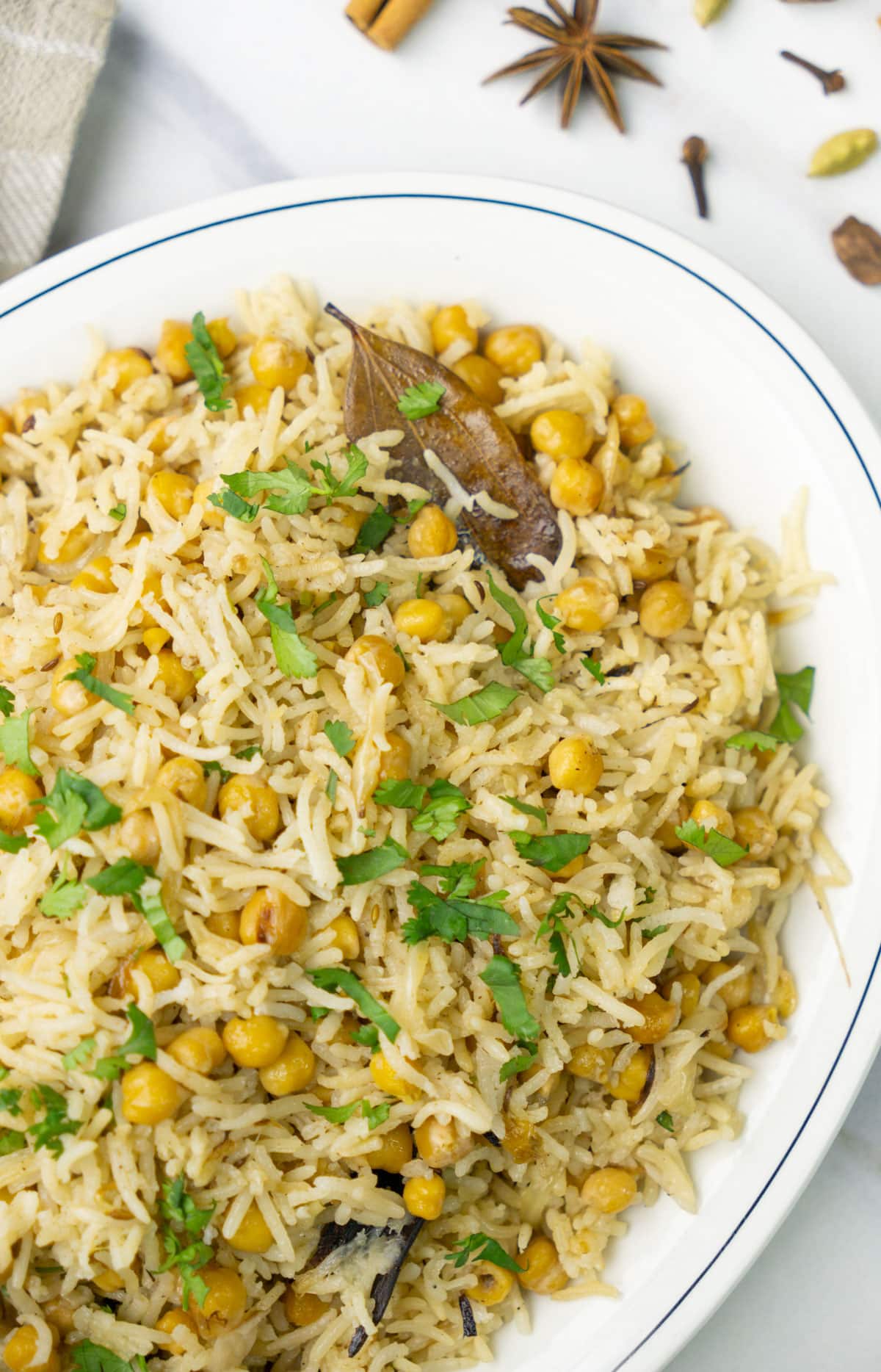 Chickpea Pulao garnished with cilantro leaves