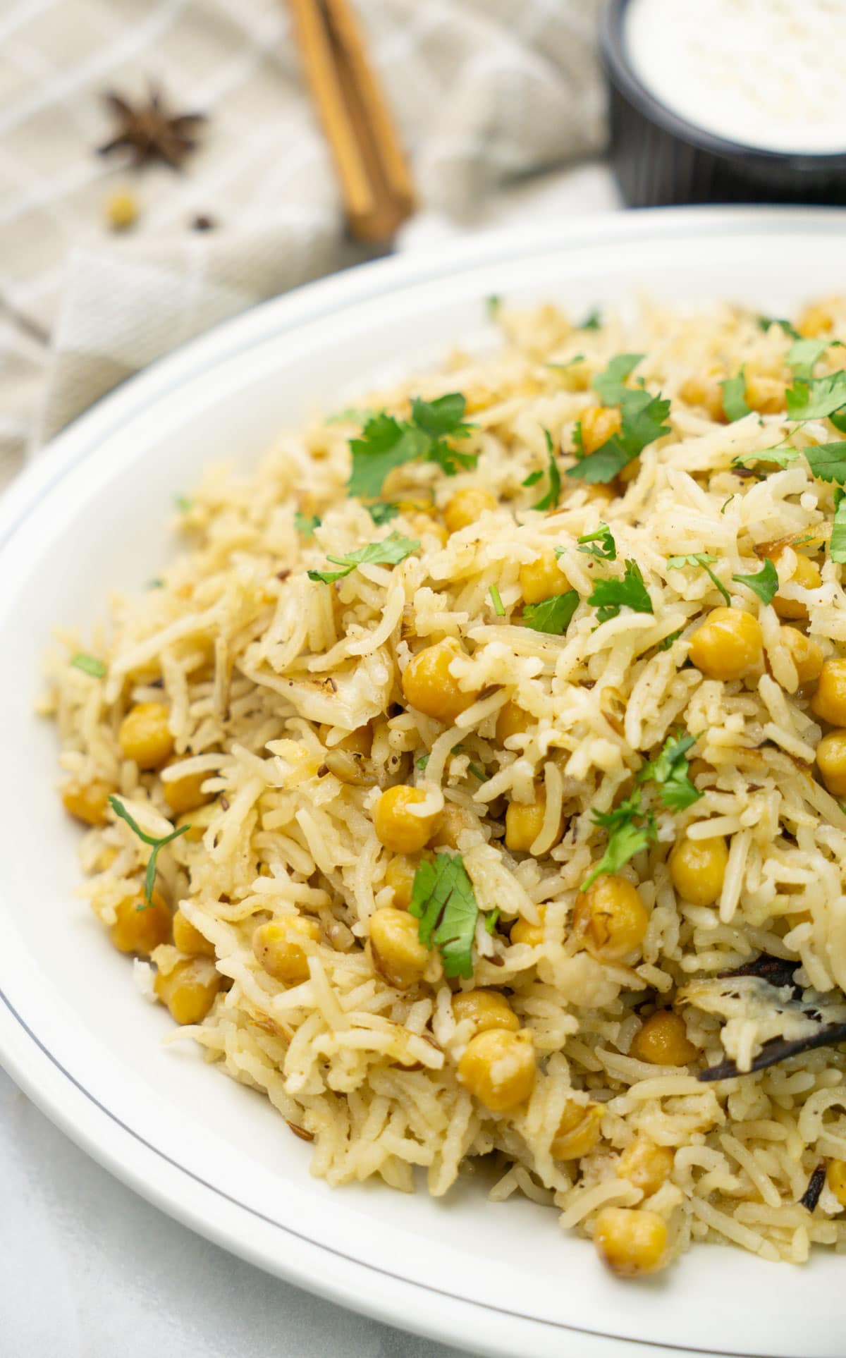 Chickpea Biryani, made of Garbanzo Beans and Rice garnished with cilantro leaves. 