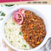 Horsegram dal served with rice in a bowl along with spiced onions