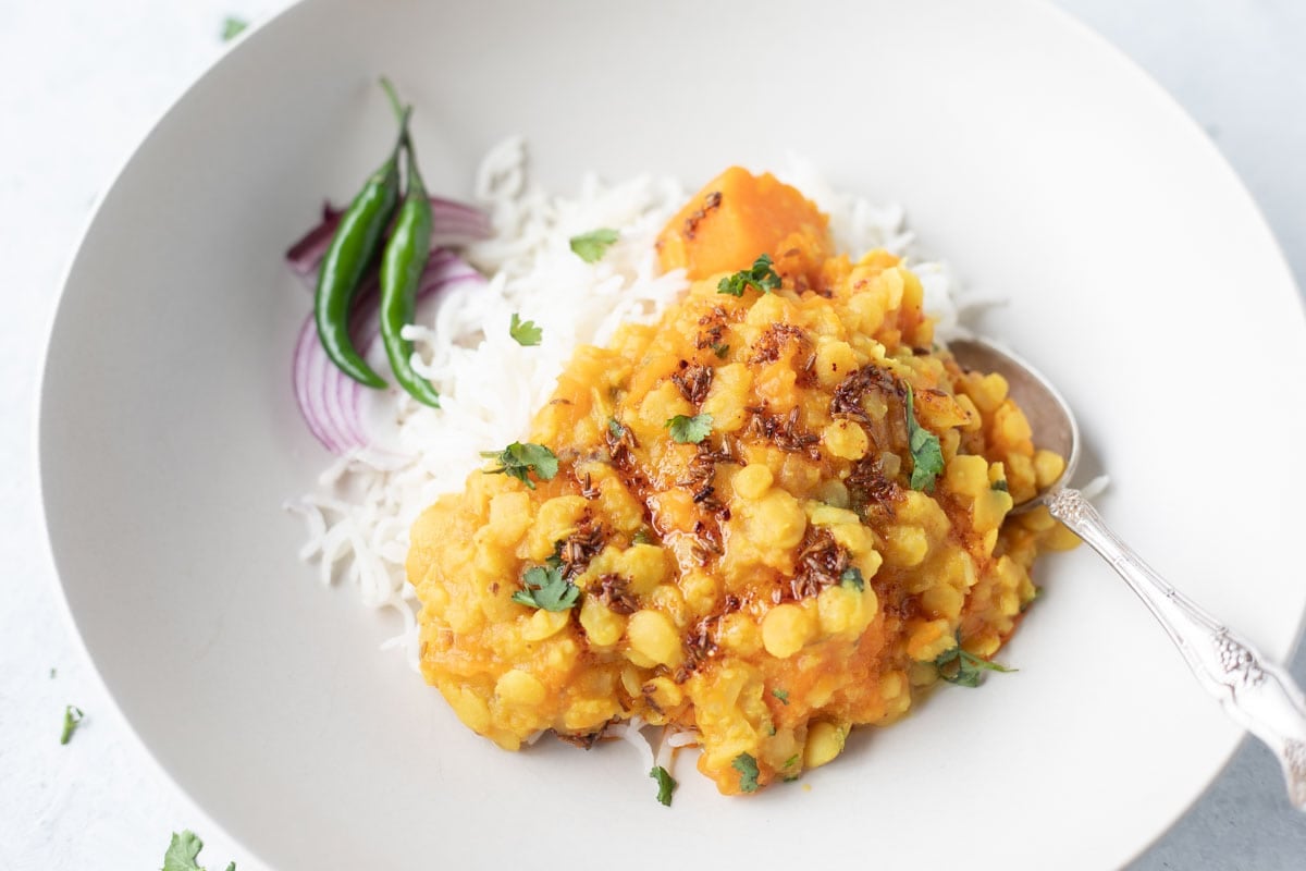 Pumpkin Dal in a plate with spoon