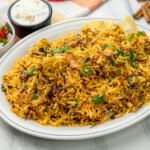 Chicken Biryani garnished with cilantro