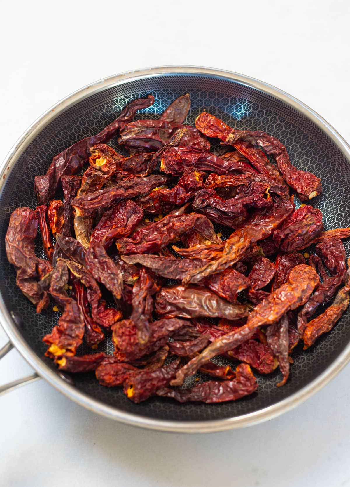 dried Kashmiri red chili in a pan