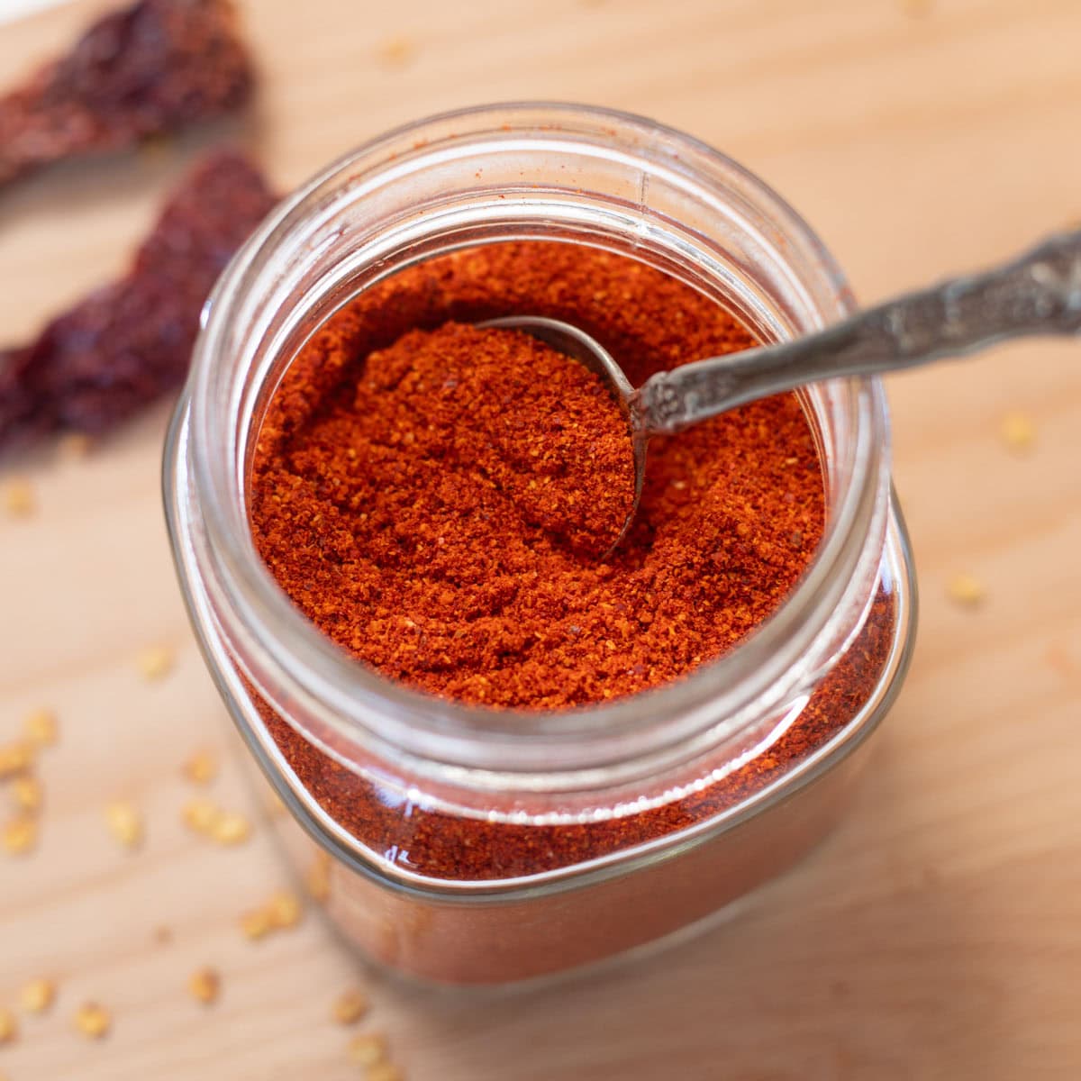 close-up shot of red chili powder in a jar