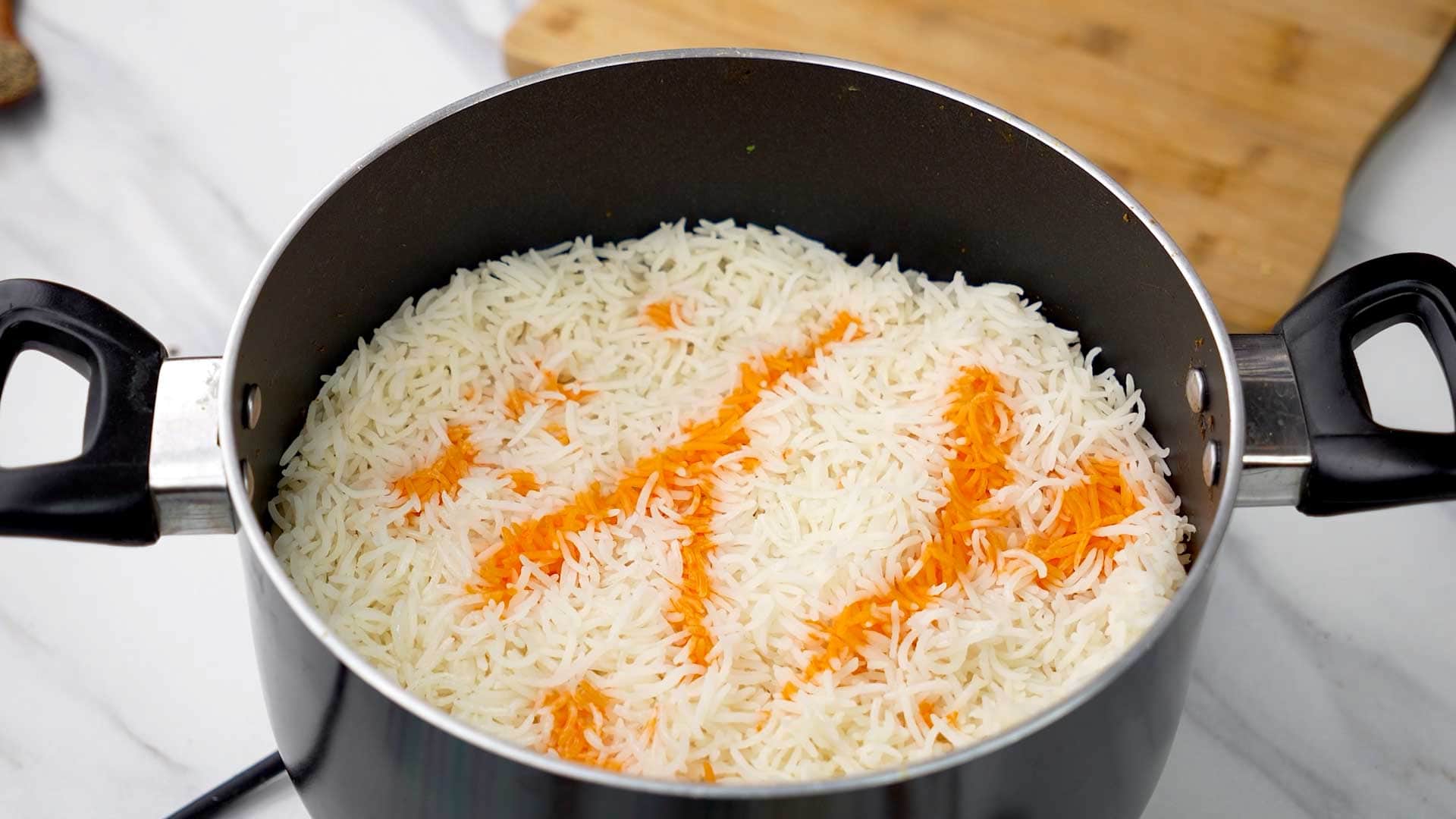 Saffron milk on the top of fluffy rice