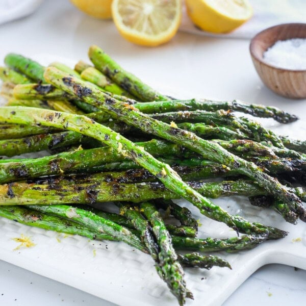 close up image of grilled asparagus in a serving plate
