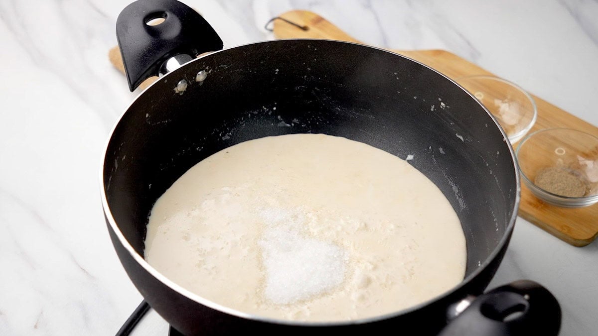 Add rice and sugar to the pan to make Paal paayasam 