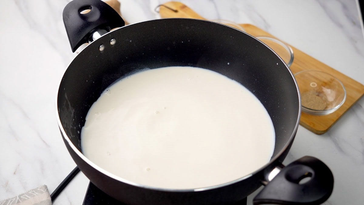 Add whole milk to heavy bottom pan to make Chawal ki kheer 