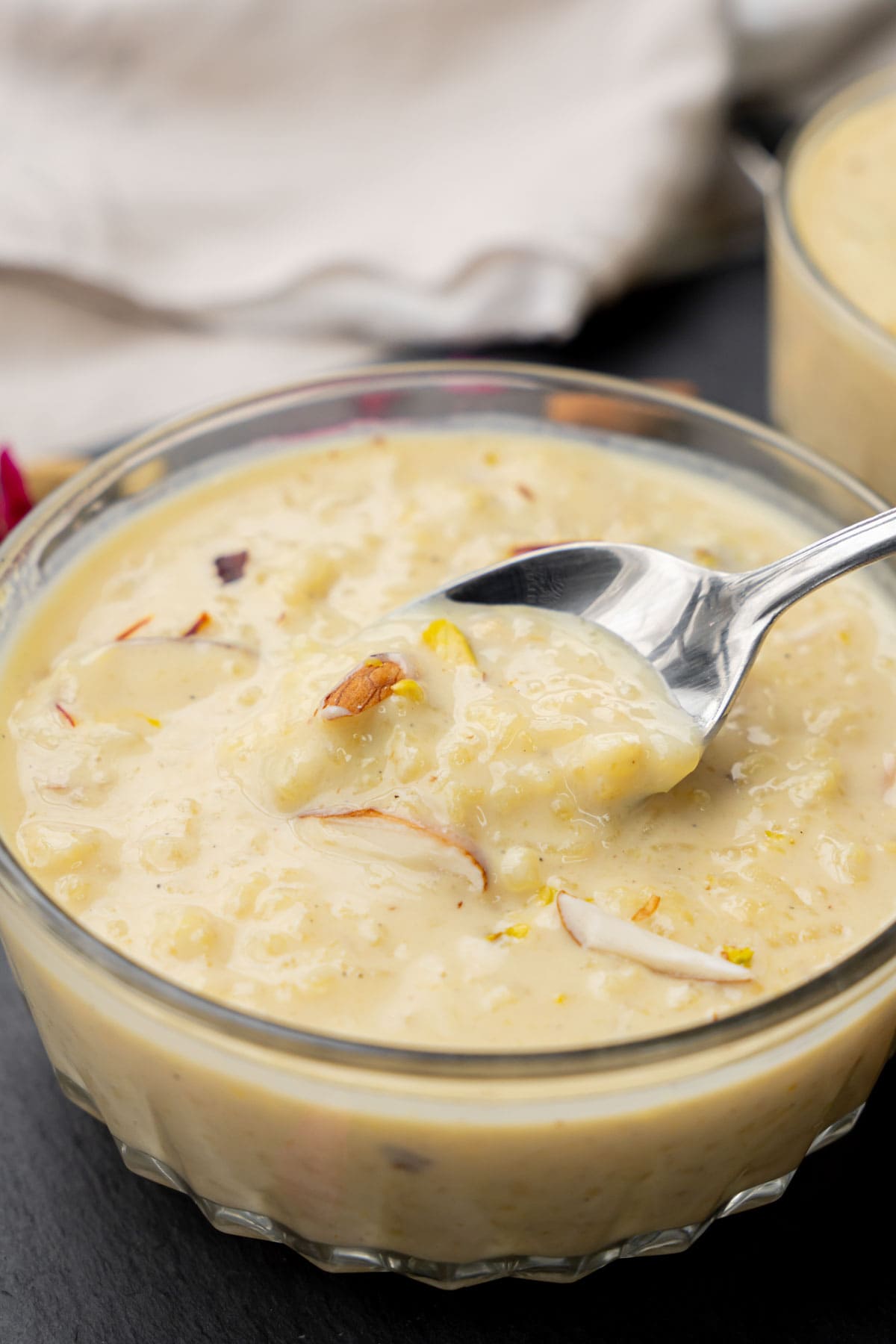 Kheer made on stovetop served in a bowl.