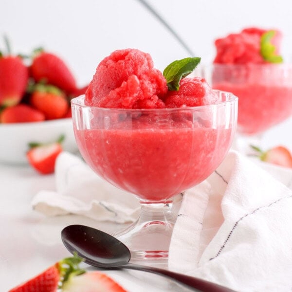 Strawberry sorbet in crystal bowls with fresh mint