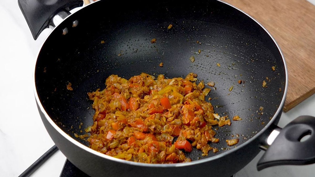 Cook until the tomatoes soften and the spices are well mixed.