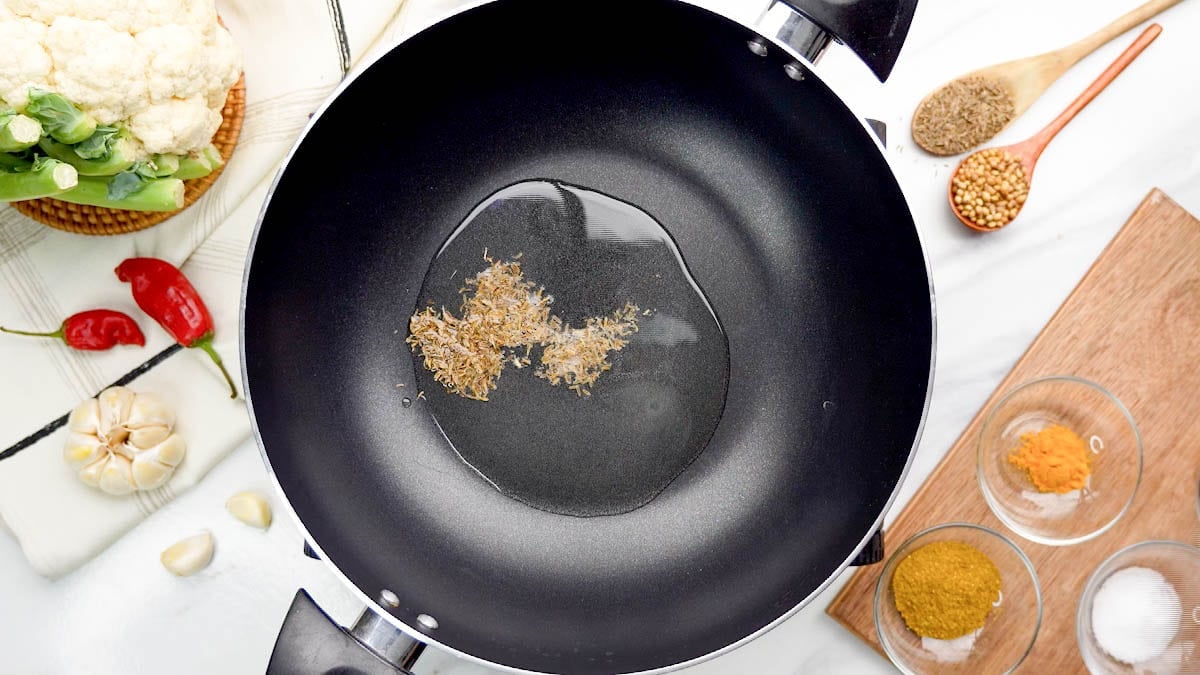 In a pan, heat some oil over medium-high heat