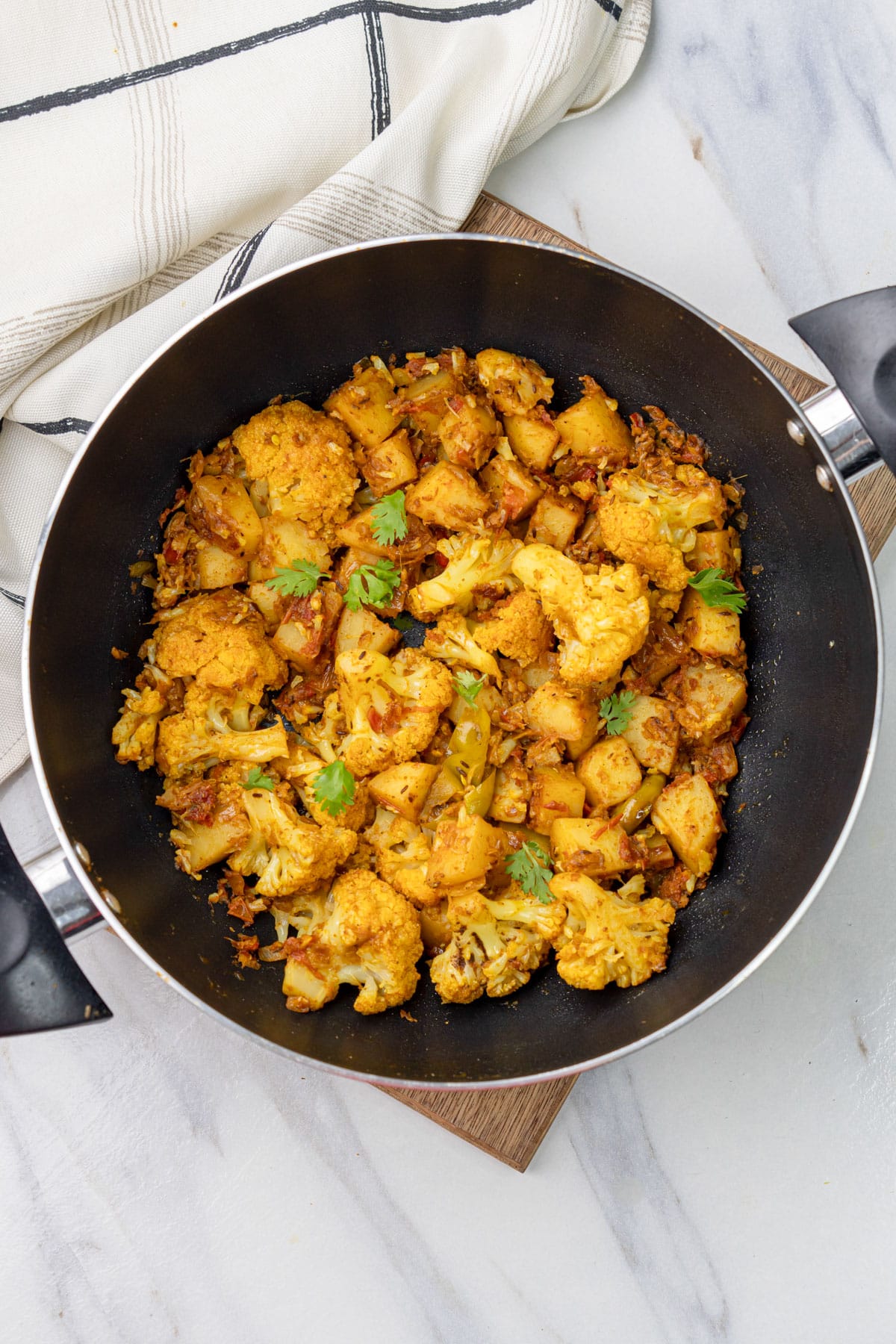 Aloo Gobi ready to be served with roti or naan.