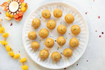top view of besan ladoo in a white plate