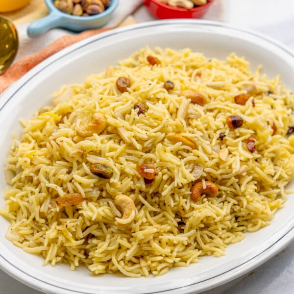 best ever saffron rice with cashews in a white plate