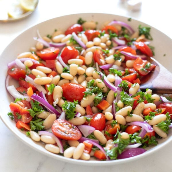 Easy Tuscan White Bean Salad is packed with Mediterranean flavors and protein.